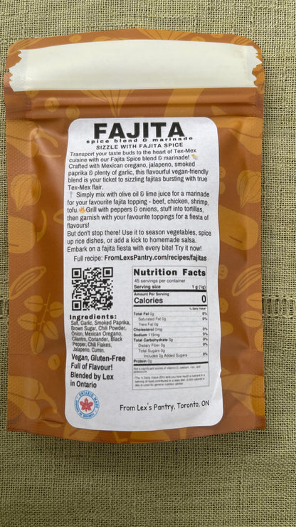 The back of a bag of Lex's Pantry's Fajita Spice Blend on a textured green fabric background. The package features a white label with product details, ingredients, and a QR code, set against a kraft-brown patterned background.