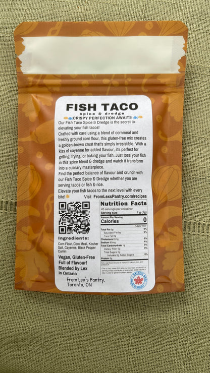 Back of Lex's Pantry Fish Taco Spice & Dredge pouch, showing the product name, ingredients, nutrition facts, and QR code on a textured green fabric background.