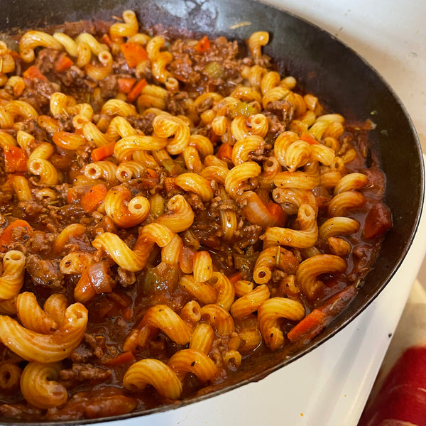 A pan of cooked pasta with a savory meat sauce made with Preston Street Italian seasoning from Lex's Pantry